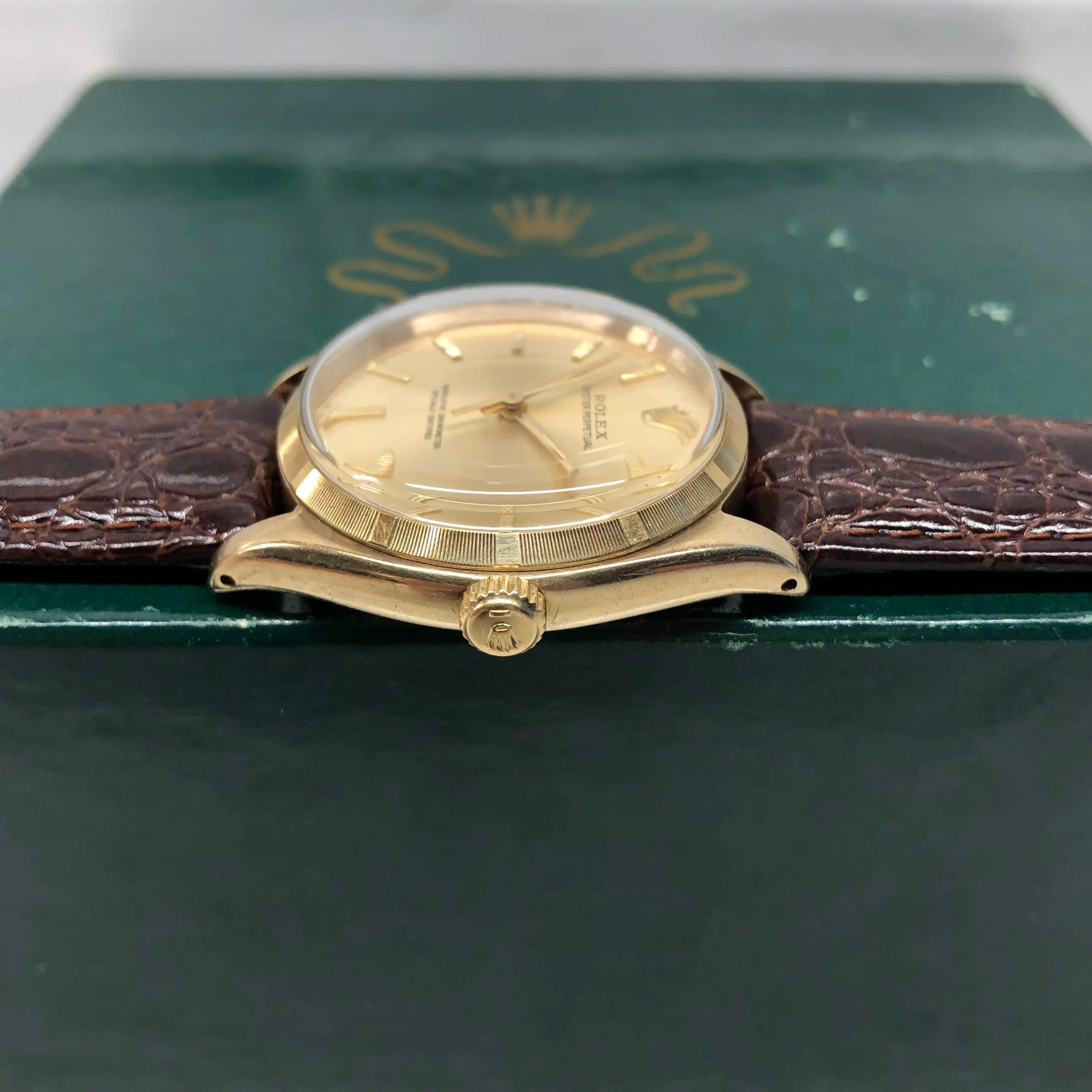1961 Rolex Oyster Perpetual 1003 9k Yellow Gold English Chronometer Engine Turned Wristwatch